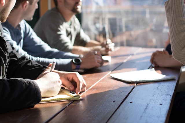 Content creating team coming up with ideas around a table